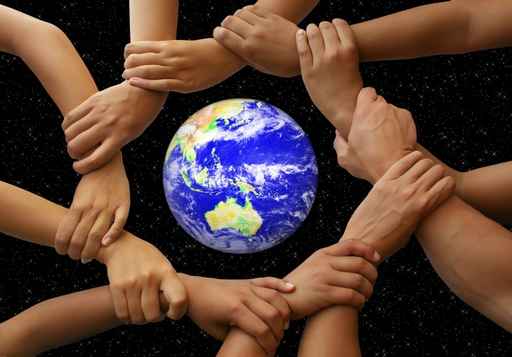 Clipart image showing people holding hands all around the world