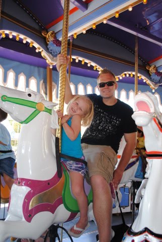 Mick and Daddy on the Merry go Round