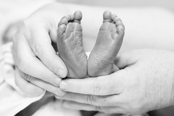 Precious feet in Nanny's hands