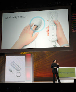 Satoru Iwata showing off the new Wii Vitality Sensor
