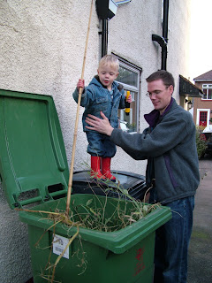 Poking the bin with a big stick