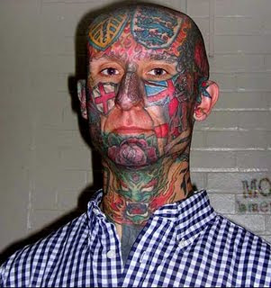 man with complete face tattoo