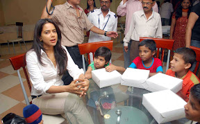 Actress Sameera Reddy hot and sexy unseen photoshoot in white shirt as the brand ambassador of Dreams Home NGO