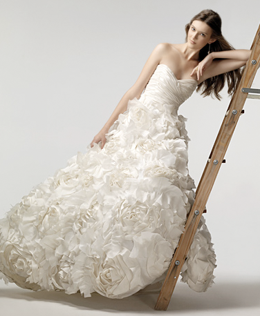 Her signature design includes silk organza ruffles in aline and ball gowns 