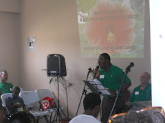 Pastor Andrew singing and giving testimony