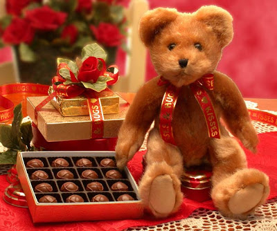 This cuddly white teddy bear makes a Valentine delivery of decadent