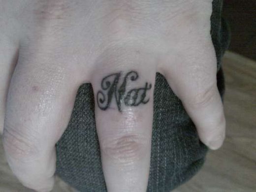 Well this Wedding Ring Tattoo must be a personal design or maybe it's her