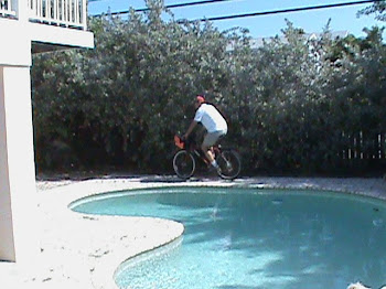 Brent bike riding the pool