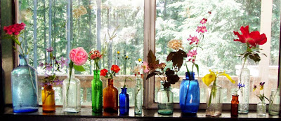wildflowers in little colored bottles