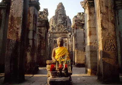 Buddha statue with offerings placed before it