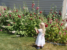 Samantha in the Hollyhocks