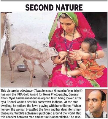 Women+breastfeeding+to+animal