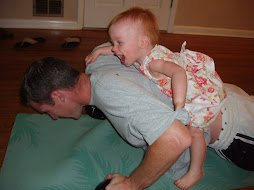 Reese doing pushups on Daddy 18 mo