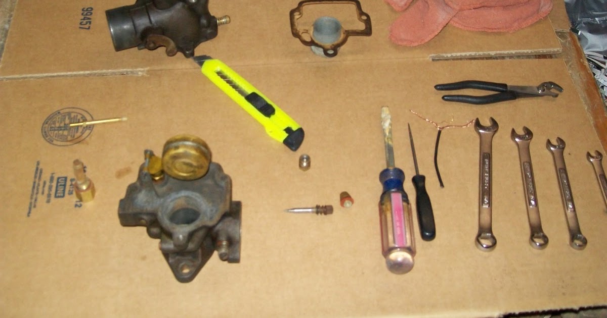 A Handfull of tools and a Hammer Farmall H Carb