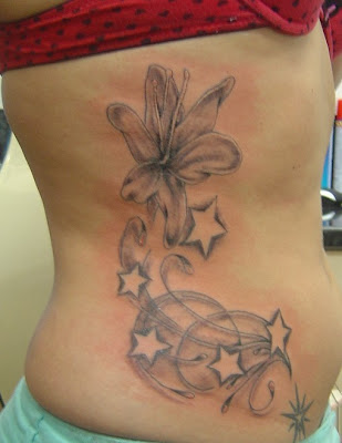 Black Flower and Star Tattoo Posted by agus at 237 AM