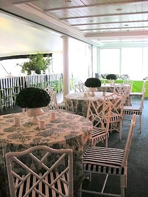 white Chippendale chairs with black and white striped seat cushions and 