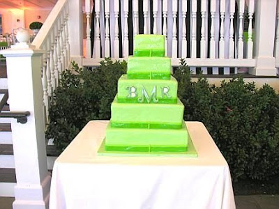 A five tier modern wedding cake mirrors the wedding 39s color scheme and