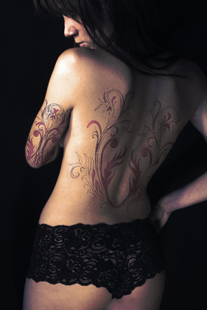 Women+tattoos+on+thigh