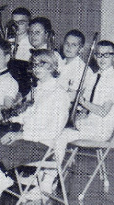Jim Hardt and Mike Sylwester pictured as trombonists and Debbie McGrew pictured as a saxophonist in the school orchestra in the 1965-1966 yearbook of St John Elementary School in Seward, Nebraska.