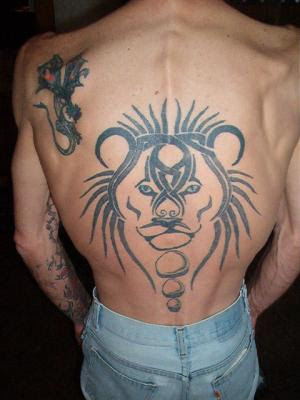 Failed tribal and even worse animal tattoo (the lion looks retarded)