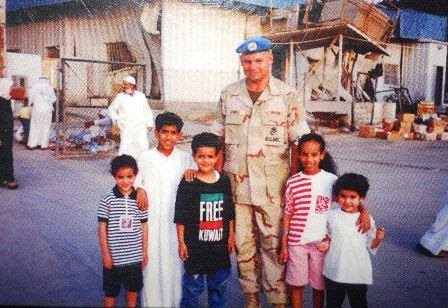Tom with kids in Kuwait