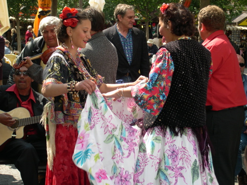 [gypsy+girl+holding+dancer's+skirt.jpg”><img decoding=]