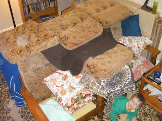 den of cushions under sofa