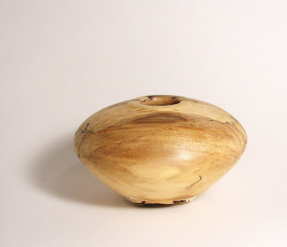 wooden vessel hollowed out on lathe