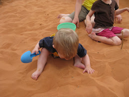 Taylor tasting the sand