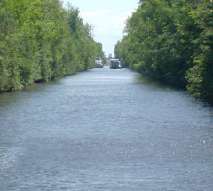 Houseboat passes CAROLYNN ANN, who has moved out of the channel.