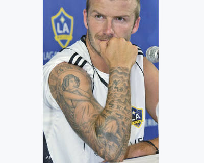 Image of David Beckham Getting A Tattoo