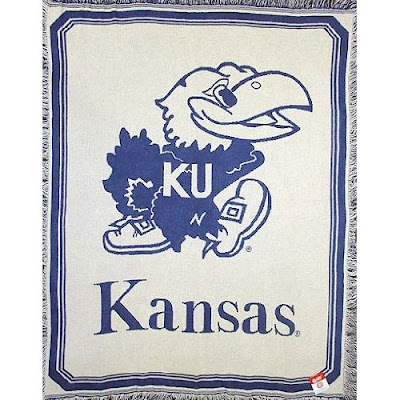 KU white Jayhawks blanket with blue trim.