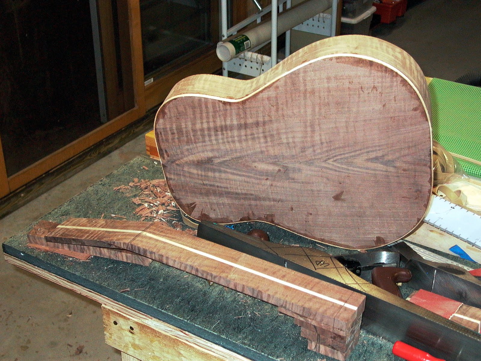 ThreeQuartersLeft Applying the binding on a walnut and cedar acoustic