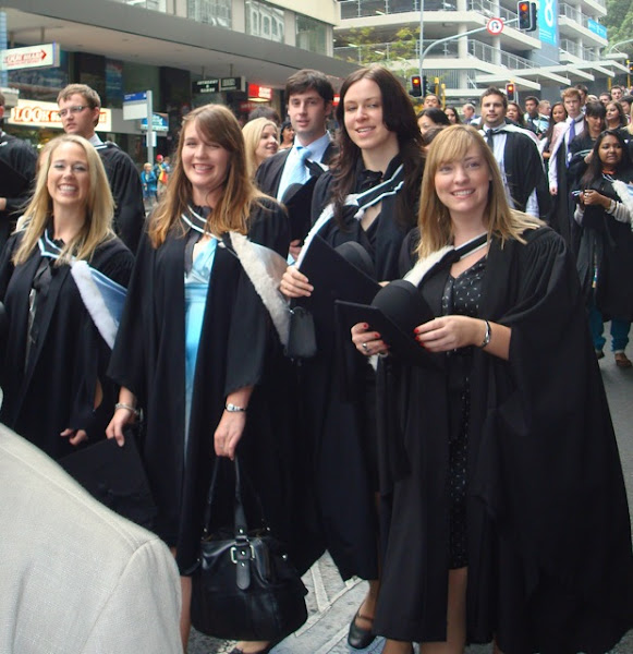 Graduates proceed down Queen St