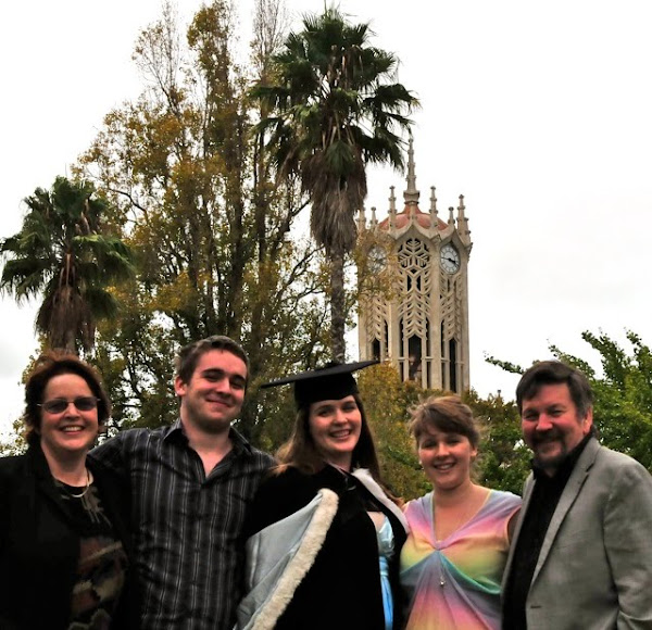 Family foto with University Clocktower