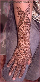 bridal henna tattoo hand and arm paste on skin