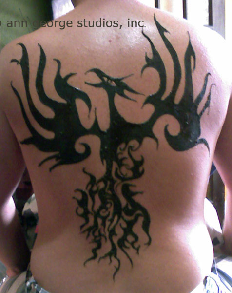 Here is a photo of a henna tattoo on the back This is a photo of the henna
