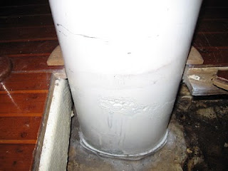 Base of Little Walk's mast showing recently painted-over corrosion and relatively clean bilge Base of Little Walk's mast showing recently painted-over corrosion and relatively clean bilge