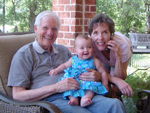 Madeleine with GrandDad and Karon in their backyard