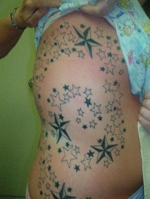 star tatoos on side body