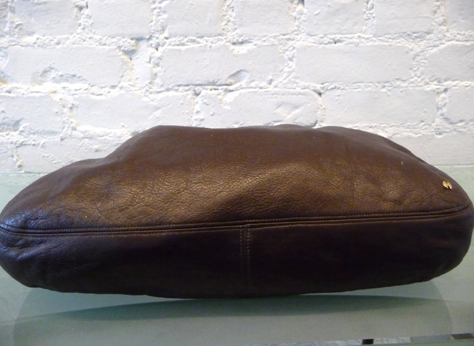 DECADES INC. "Over the shoulder boulder holder"