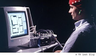 Image of a man playing a simple PC game with his mind.