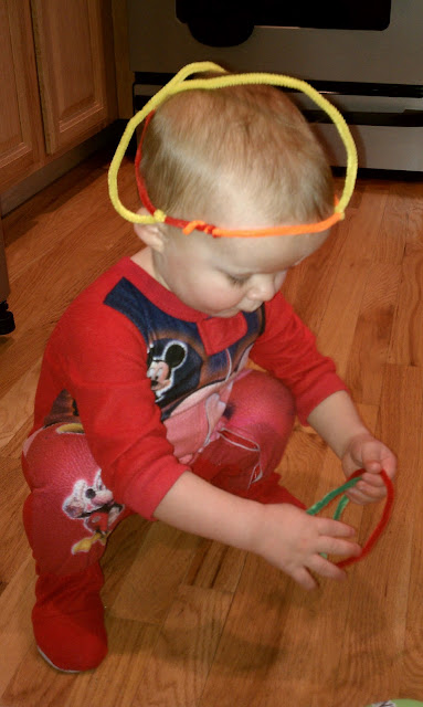 JD playing with pipe cleaners.