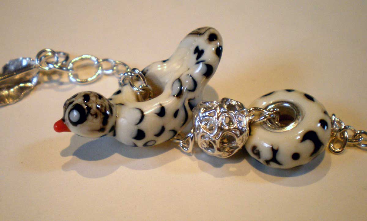 [Bird-bead-on-a-bracelet.jpg]