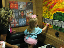 Eva signing Candy Coburns tour bus