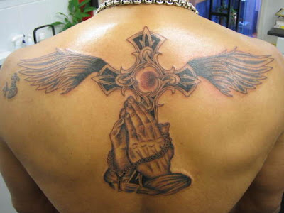 cross tattoos with wings on arm. Women Cross Tattoos Designs