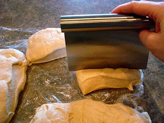cutting dough in pieces