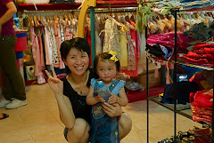 Mary Kate with a shop owner in GZ