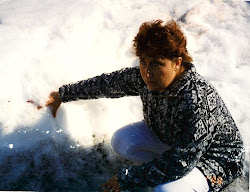Mary with her thumb in the snowbank after she fell.
