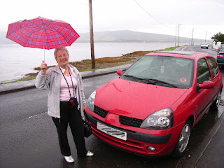 CraftyWhippet singing in the rain with her far-travelled wee car